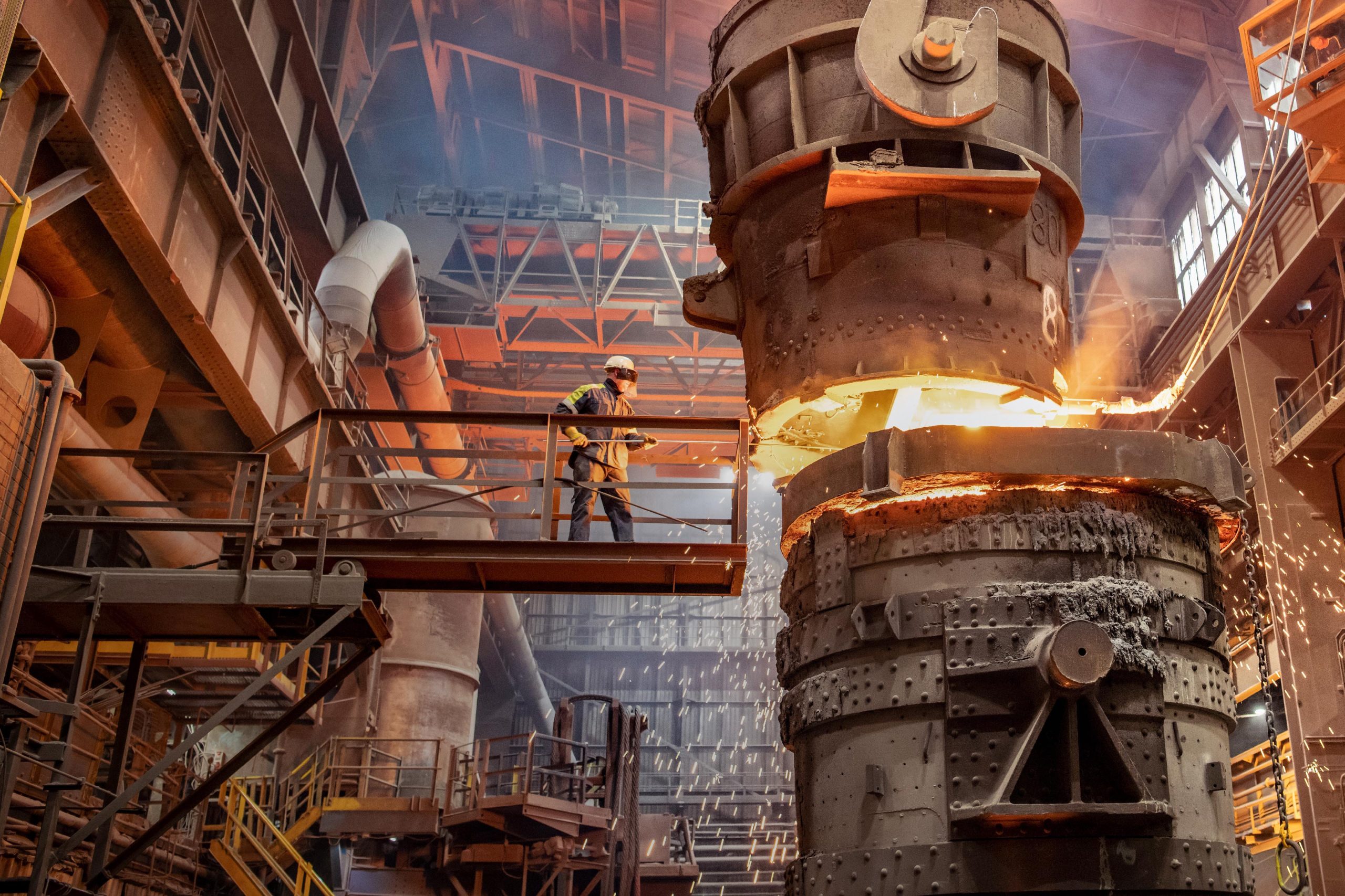 Steelworker starting molten steel